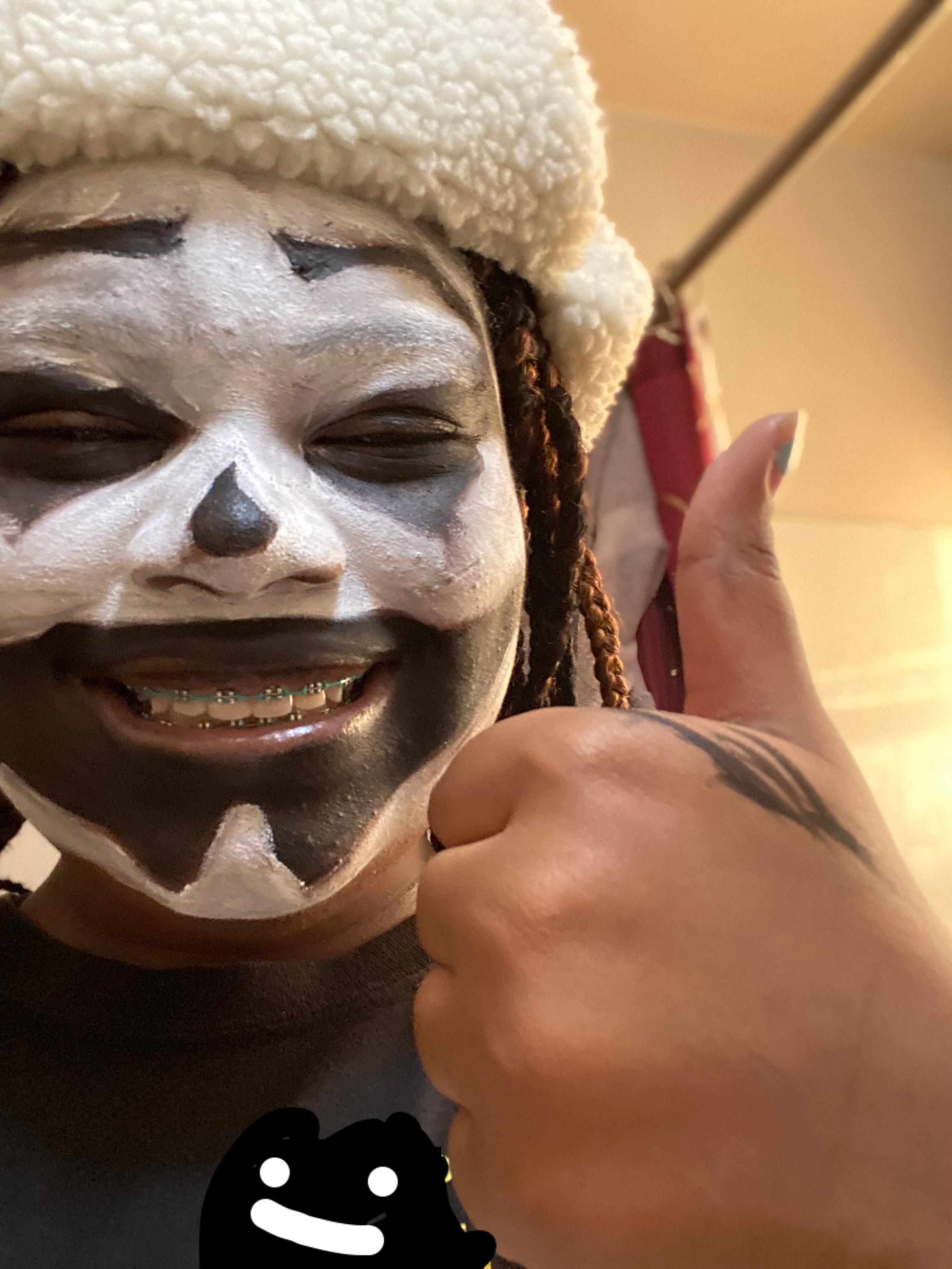 close-up selfie portrait of black juggalo man giving a thumbs-up.jpg