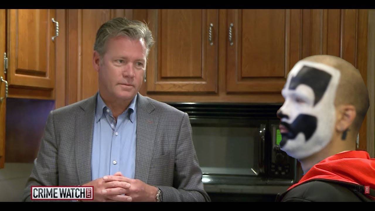 chris hansen on the left is talking to a blurry juggalo on the right who is sitting down on an episode of the CRIMEWATCH show. the show's logo is visible in the lower left corner and the image has black bars across the top and bottom.jpg