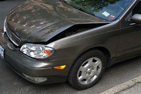 car with large dent on door