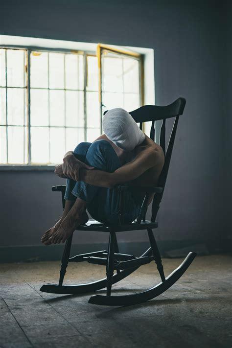 person sitting leaning left in chair